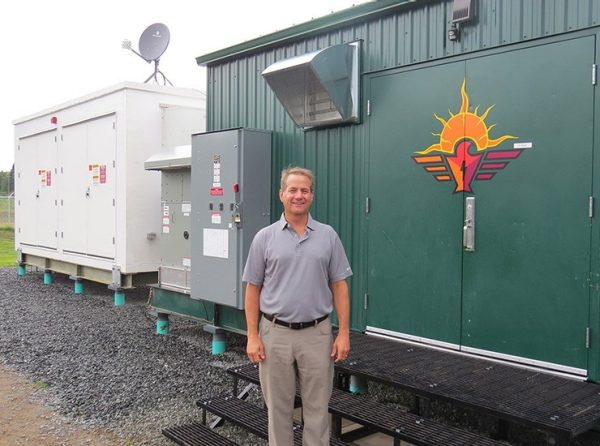 Peter Bright stands in front of the EHouse