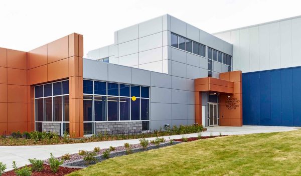 Front entrance to the City of Calgary Compost Facility featuring large-panel multi-colored cladding.