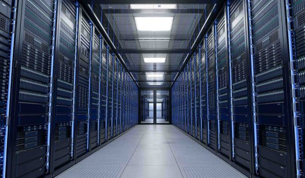 Inside Large Data Center. Advanced Cloud Computing Concept. Corridor with Server Racks and Cabinets full of Hard Drives