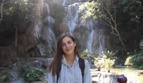 Amber with a waterfall in the background.