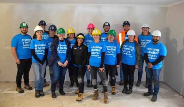 Group image of Stantec staff in hard hats at a Habitat for Humanit site. Amir Gharavi, Amy Rentz, Andrew Frankiw, Arianny Marquez, Brittany Steele , Chella Thornton, Christina Poletto, Erin Ritchie, Freddie Sawyer , Jamie Armitage, Julia Carnevale, Kayla Eustaquio, Nick Weir, Samantha Smith, Shah Miraj