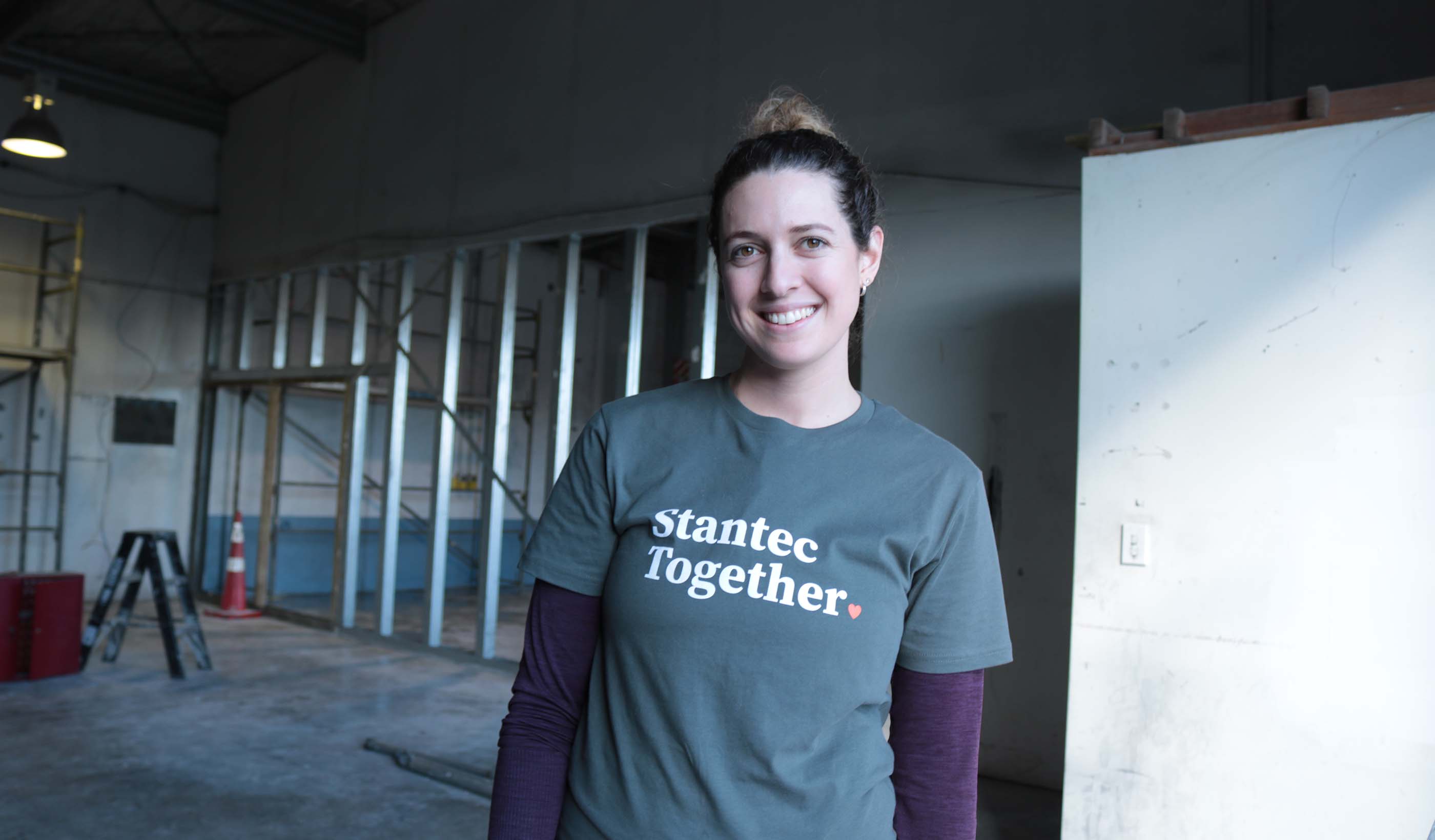 Image of Ashleigh Denize volunteering on a worksite wearing a Stantec Together t-shirt.