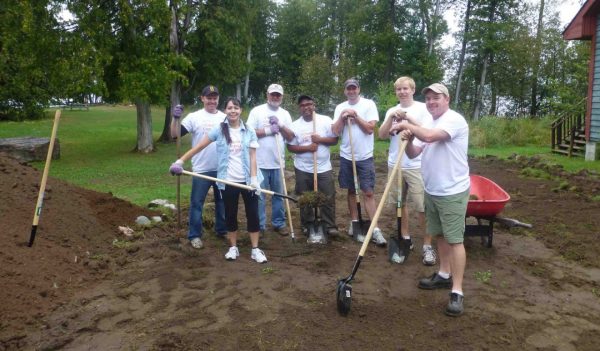 A team is cleaning up the garden at Camp Smitty