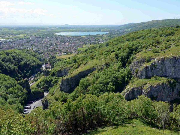 view over fields and houses to cheddar gorge