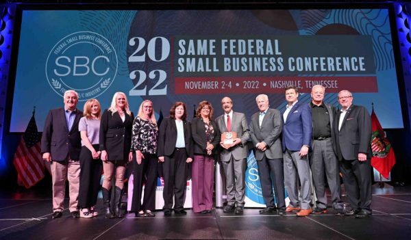 People on stage accepting an award