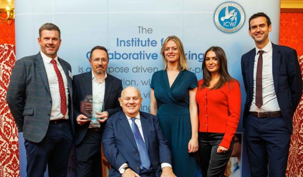 Group photo of team winning the award, featuring Louis Quartly, Ross Anderson, Lord Evans of Watford (Chairman of ICW), Ellen Genetello, Alanna Barnes, Marc Connor