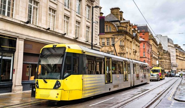 Image of city yellow tram in the centre of Manchester,