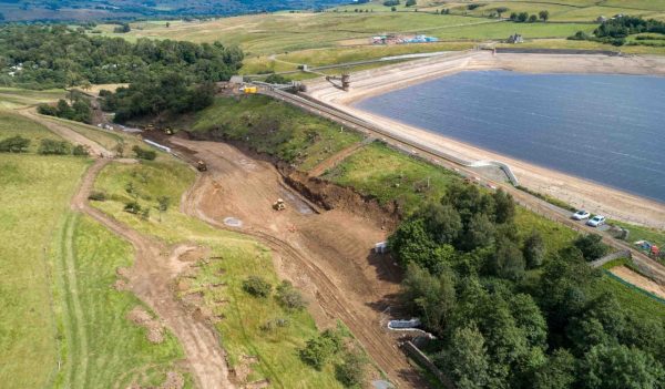 Aerial view of the Grassholme reservoir surrounded by green fields.