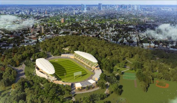 Aerial rendering of a new soccer stadium surrounded by trees, playing fields, and the city beyond