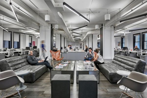 Open lounge seating in the middle of workstation space