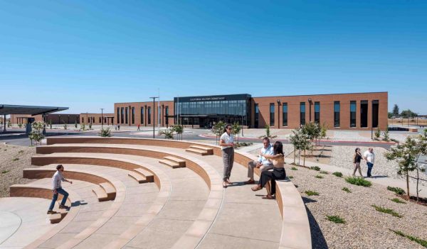 Exterior tiered seating area with plantings and walkways