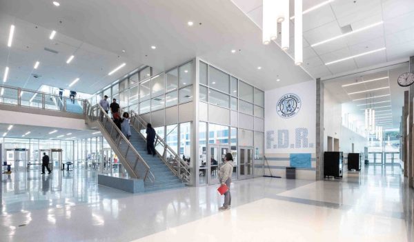 Large main entrance with stairs to upper floors and corridors