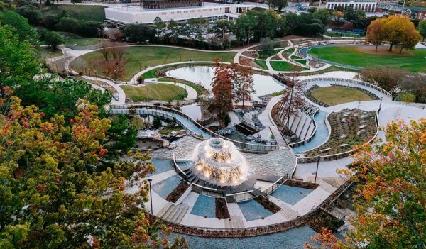 Aerial view of  a central fountain with pools, walkways, and plantings