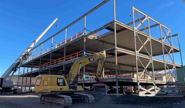 View of the building under construction with the structural walls and floors.