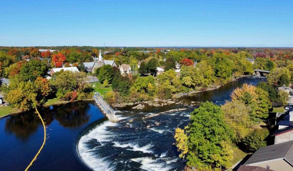 View of the lake and surrounding trees and town